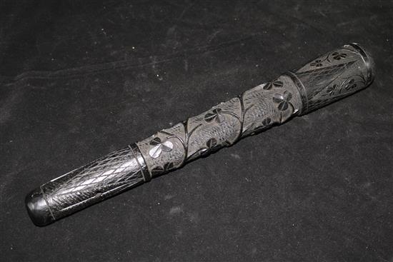 A carved bog oak truncheon